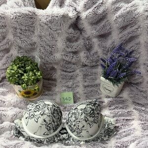 La SENZA Diva Demi Bra in white and Black along with tiny, sparkly gems